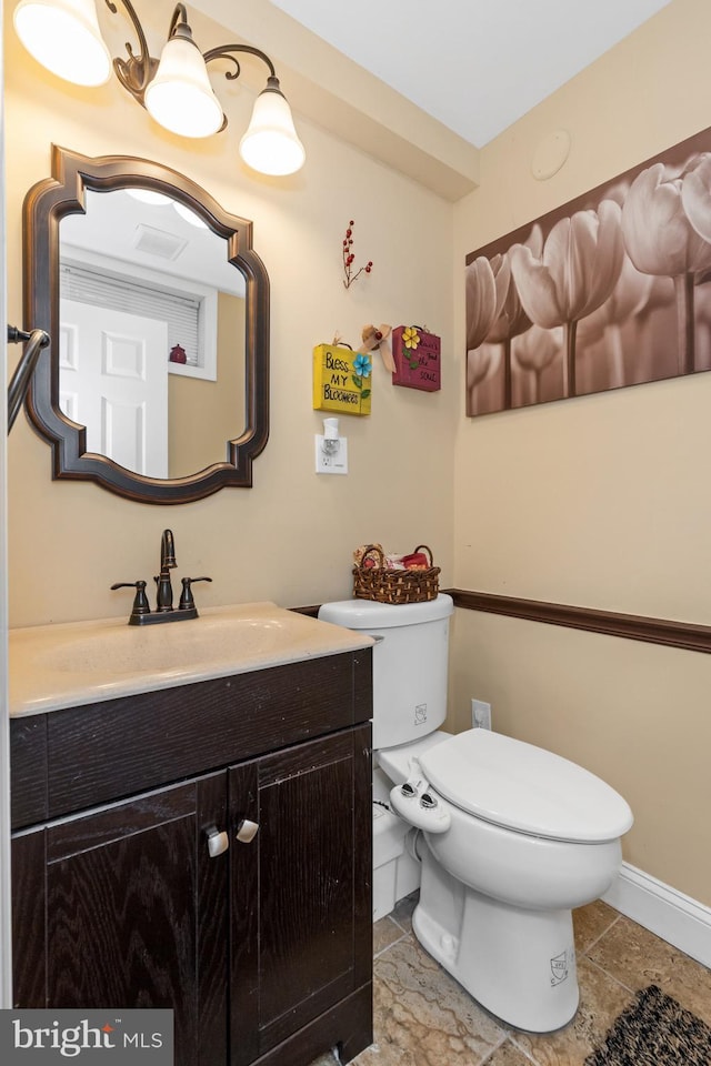 bathroom with vanity and toilet