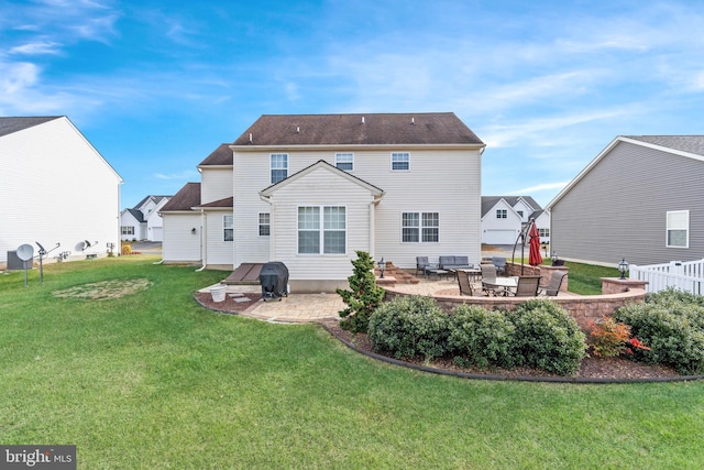 back of property featuring a yard and a patio