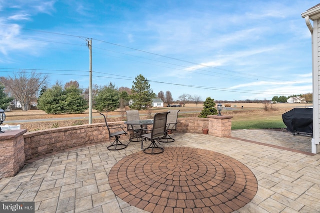 view of patio featuring a grill