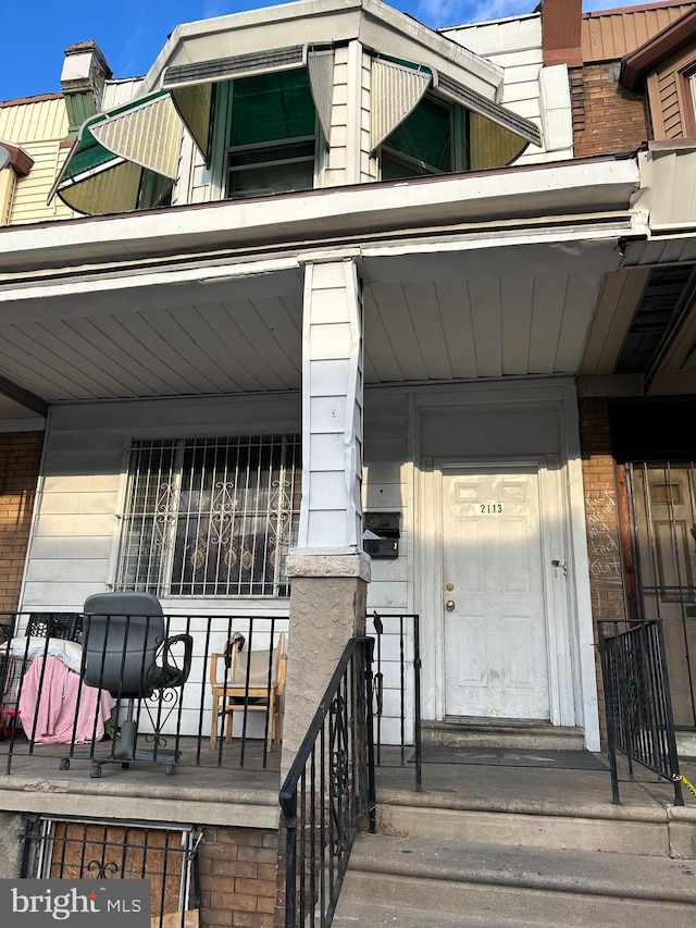 doorway to property with a porch