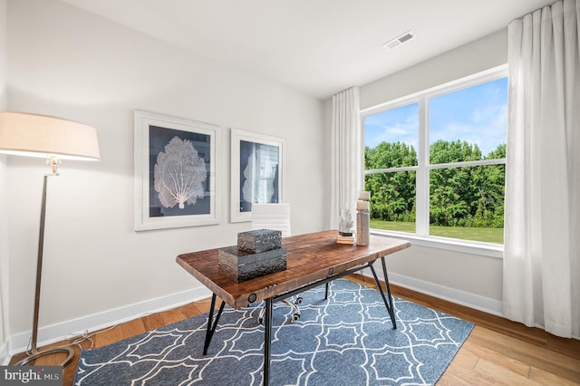 home office with light wood-type flooring