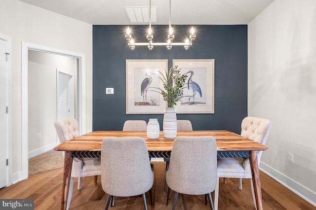 dining area with hardwood / wood-style floors