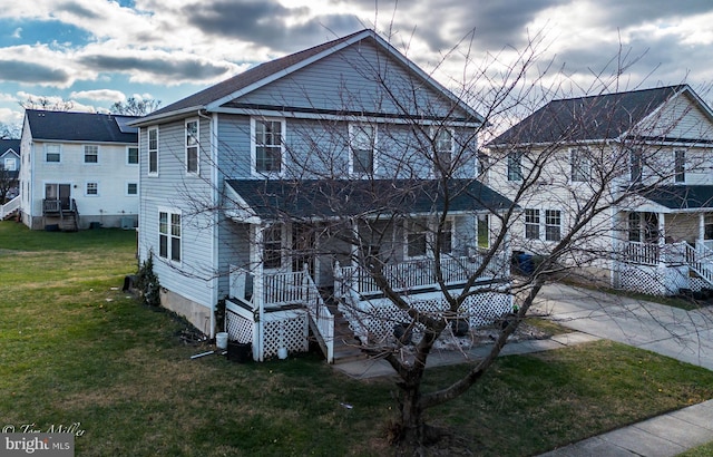 view of front of property featuring a porch and a front lawn