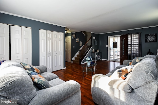 living room with dark hardwood / wood-style floors and ornamental molding