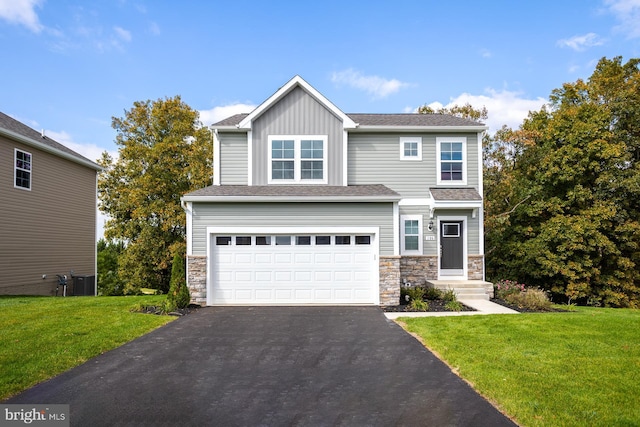 view of front facade featuring a garage and a front lawn