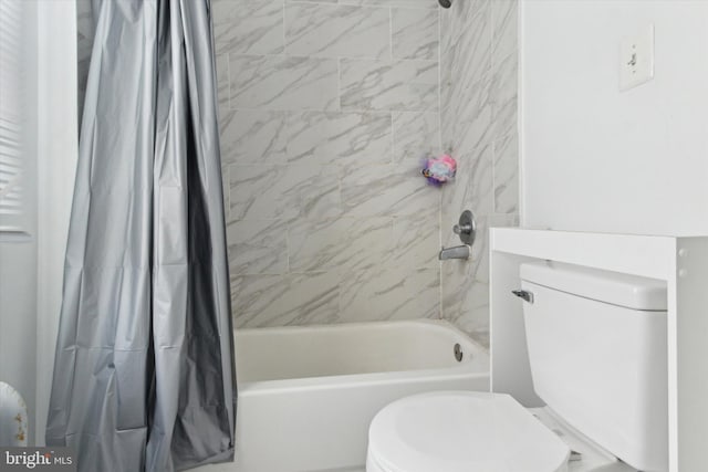 bathroom with shower / bath combination with curtain and toilet