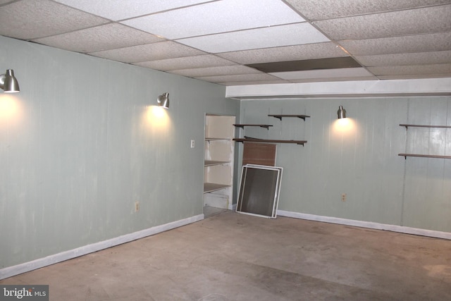 basement featuring a paneled ceiling