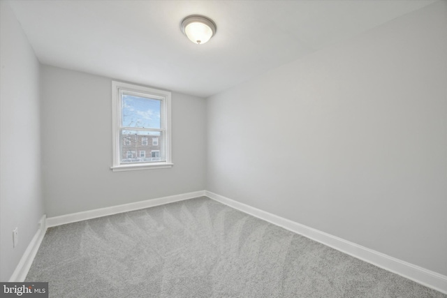 spare room featuring carpet floors