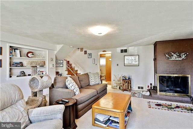 carpeted living room featuring a fireplace