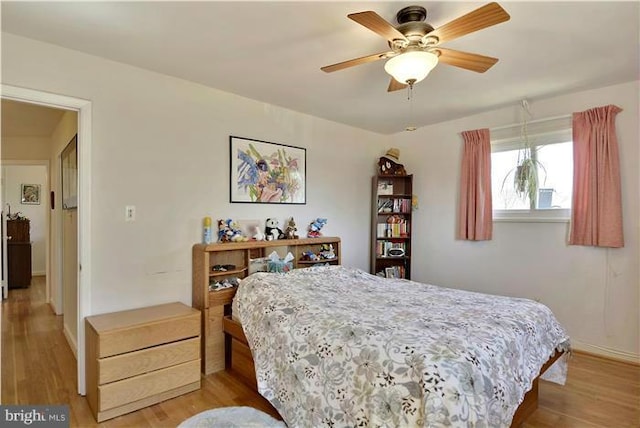 bedroom featuring ceiling fan and light wood-type flooring