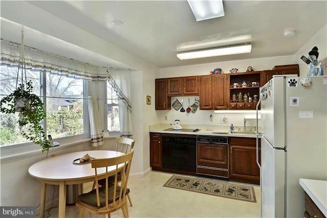 kitchen with sink and black appliances