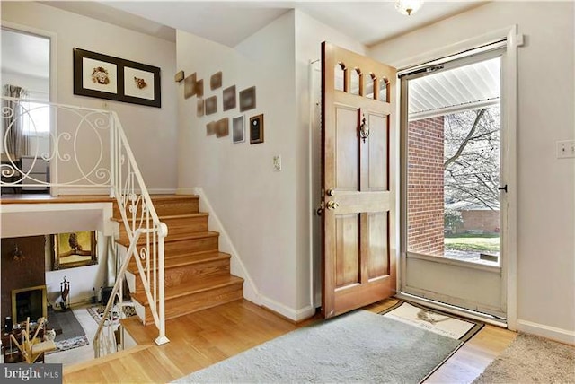 foyer entrance featuring hardwood / wood-style floors