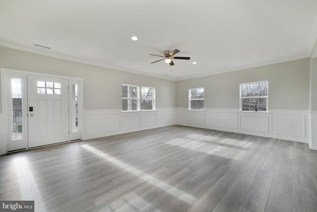 entrance foyer with ceiling fan, ornamental molding, wood finished floors, and recessed lighting