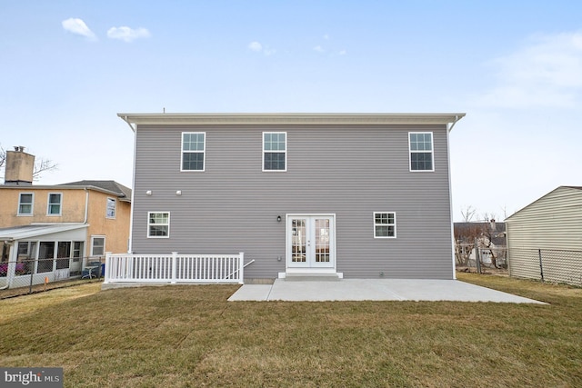 rear view of property with a yard, french doors, a patio, and fence private yard