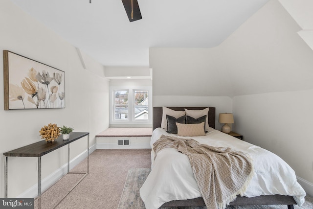 carpeted bedroom featuring ceiling fan and lofted ceiling