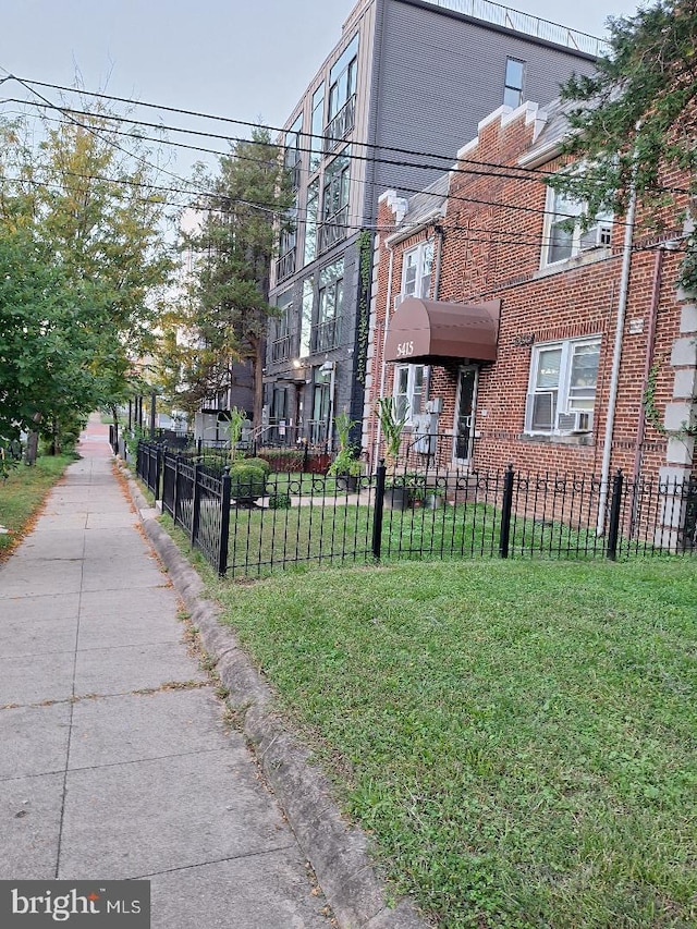 view of side of property with a lawn