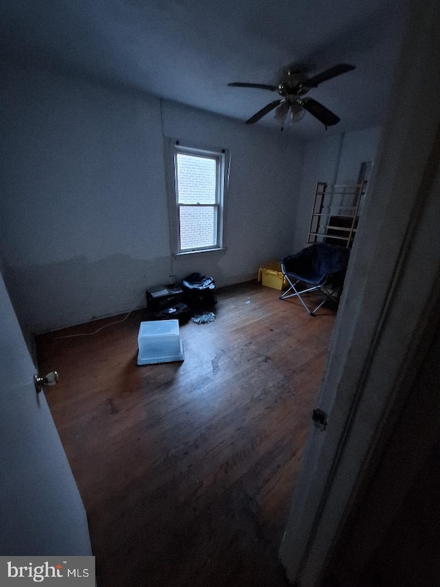 interior space featuring hardwood / wood-style floors and ceiling fan