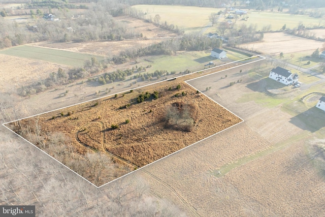 birds eye view of property with a rural view