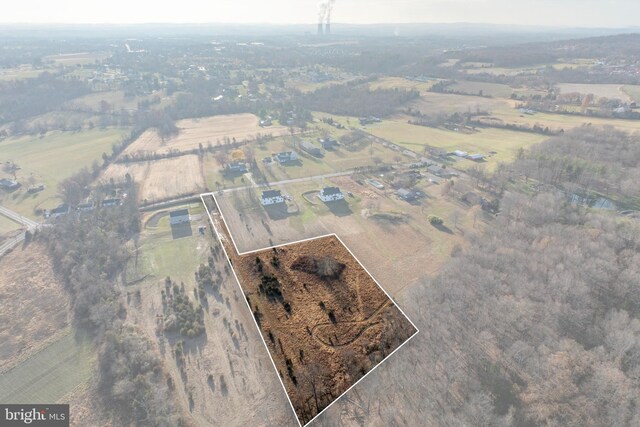 birds eye view of property featuring a rural view