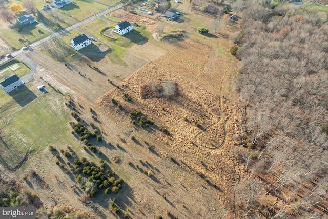 birds eye view of property featuring a rural view