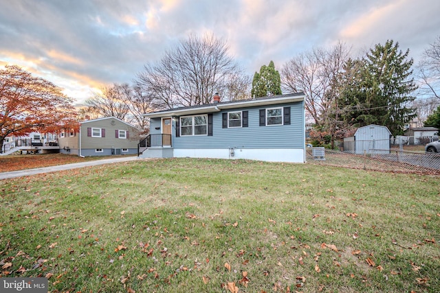 view of front of property with a lawn