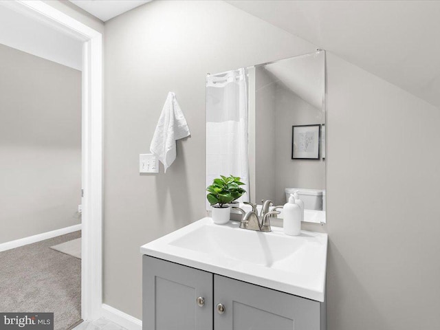 bathroom with vanity and toilet