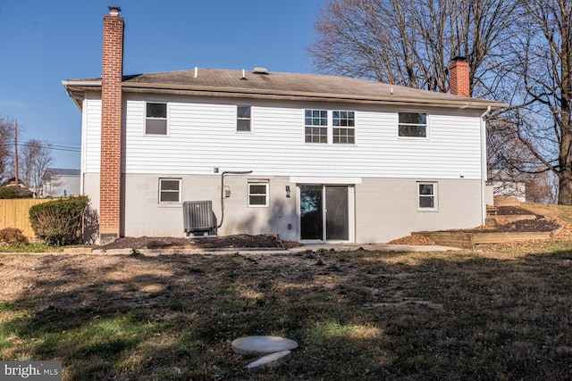 rear view of house with a lawn