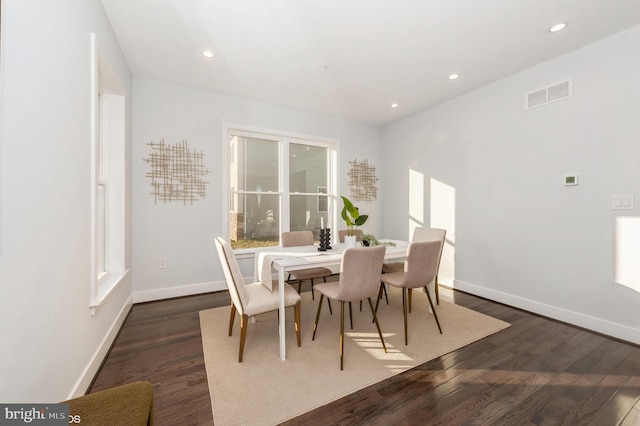 dining area with dark wood-type flooring