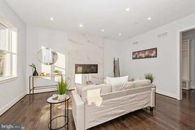 2418 Taney Rd, Baltimore, MD 21209 - living area with recessed lighting, wood finished floors, and baseboards