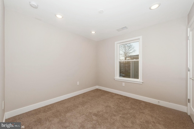 2418 Taney Rd, Baltimore, MD 21209 - carpeted spare room with baseboards, recessed lighting, and a smoke detector