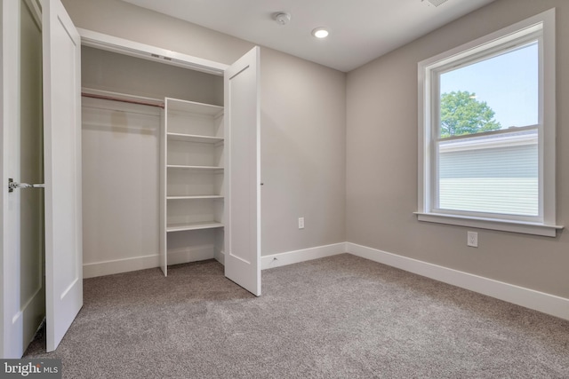 2418 Taney Rd, Baltimore, MD 21209 - unfurnished bedroom with carpet floors, multiple windows, baseboards, and recessed lighting