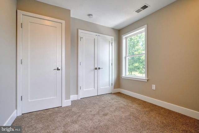 2418 Taney Rd, Baltimore, MD 21209 - unfurnished bedroom with carpet, baseboards, and a closet