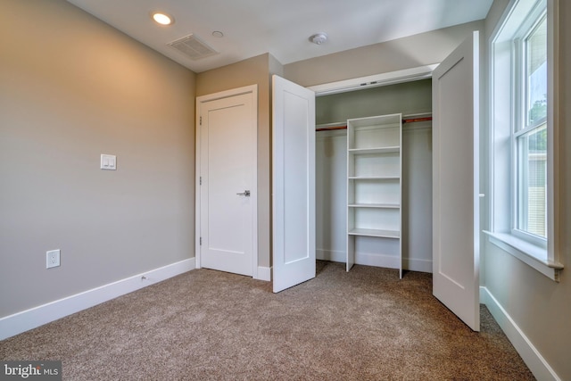 2418 Taney Rd, Baltimore, MD 21209 - unfurnished bedroom with carpet, a closet, baseboards, and recessed lighting