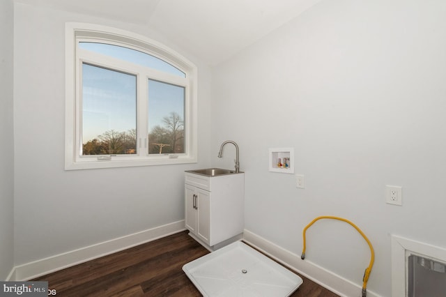 2418 Taney Rd, Baltimore, MD 21209 - laundry area featuring cabinet space, washer hookup, dark wood-style floors, and baseboards
