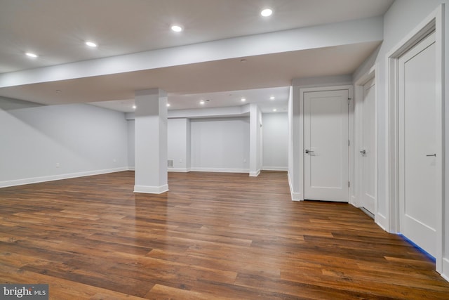 2418 Taney Rd, Baltimore, MD 21209 - finished below grade area with dark wood-type flooring, baseboards, and recessed lighting