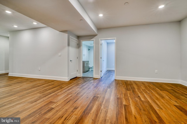 2418 Taney Rd, Baltimore, MD 21209 - spare room with wood finished floors, baseboards, and recessed lighting