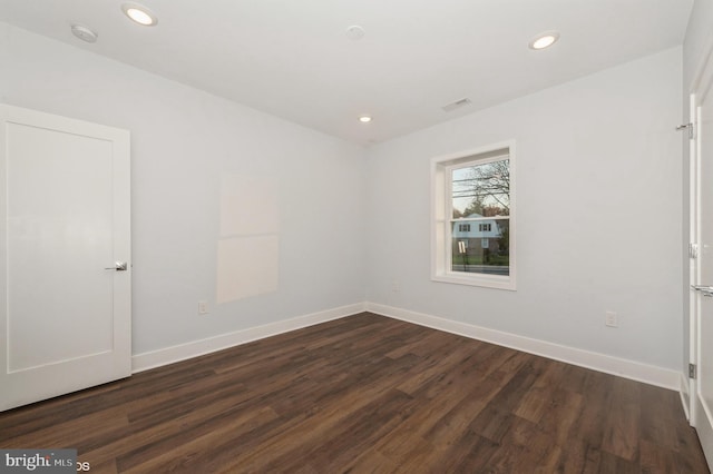 empty room featuring dark hardwood / wood-style floors