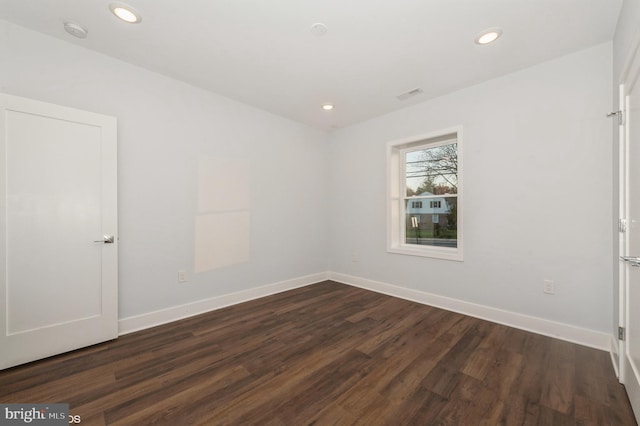 2418 Taney Rd, Baltimore, MD 21209 - empty room featuring dark wood-style flooring, a smoke detector, recessed lighting, and baseboards