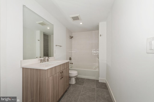 full bathroom featuring vanity, tile patterned floors, tiled shower / bath combo, and toilet