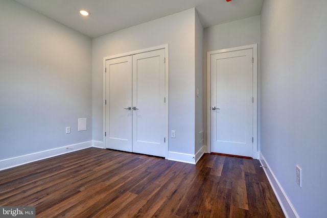 2418 Taney Rd, Baltimore, MD 21209 - unfurnished bedroom featuring dark wood-style flooring, baseboards, a closet, and recessed lighting