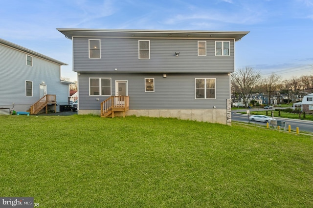 2418 Taney Rd, Baltimore, MD 21209 - rear view of house with a yard and entry steps