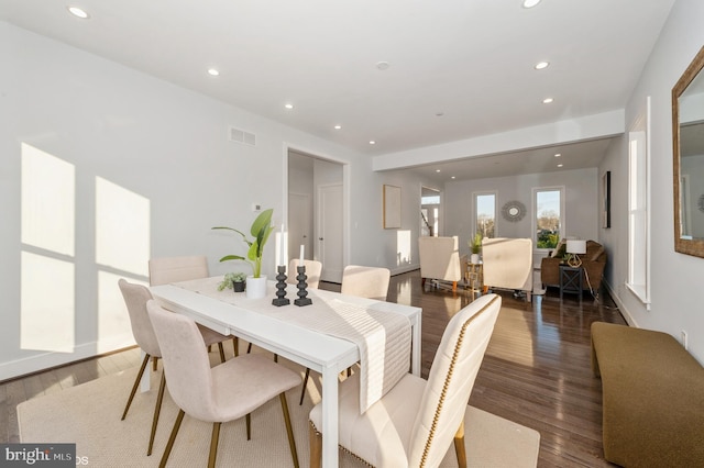 dining space featuring dark hardwood / wood-style flooring