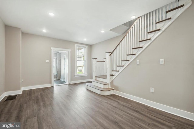 foyer entrance featuring dark hardwood / wood-style floors