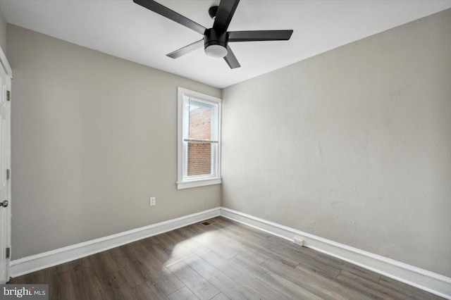 unfurnished room with ceiling fan and hardwood / wood-style flooring