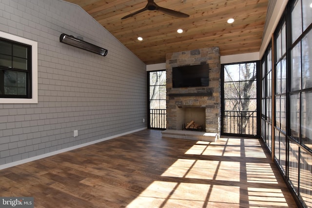 20682 Maple St, Rehoboth Beach, DE 19971 - unfurnished living room featuring a ceiling fan, vaulted ceiling, wooden ceiling, an outdoor stone fireplace, and wood finished floors