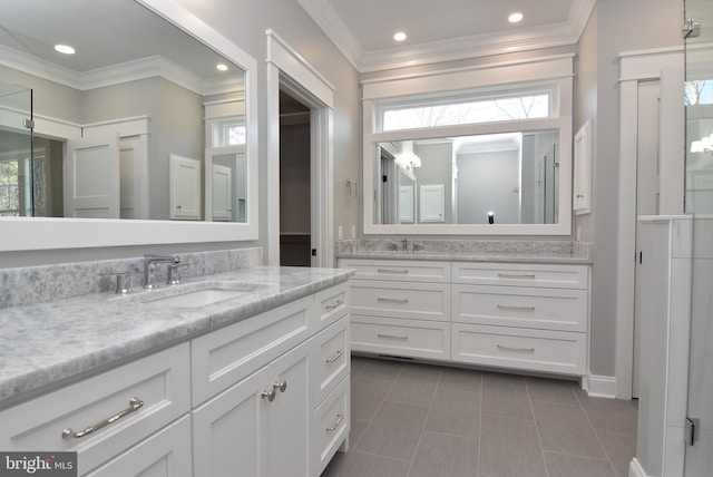 20682 Maple St, Rehoboth Beach, DE 19971 - full bathroom with two vanities, crown molding, tile patterned floors, and recessed lighting
