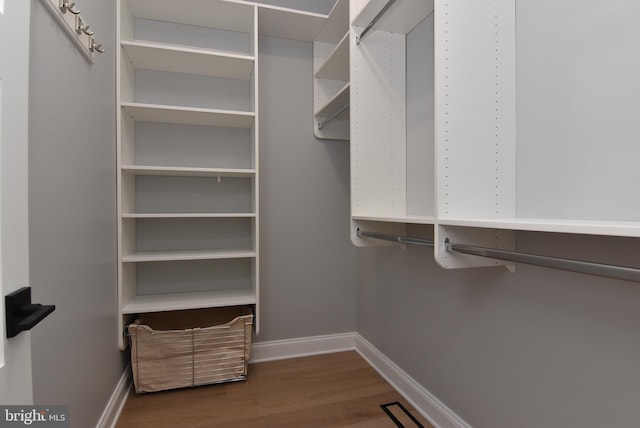 20682 Maple St, Rehoboth Beach, DE 19971 - spacious closet featuring wood finished floors