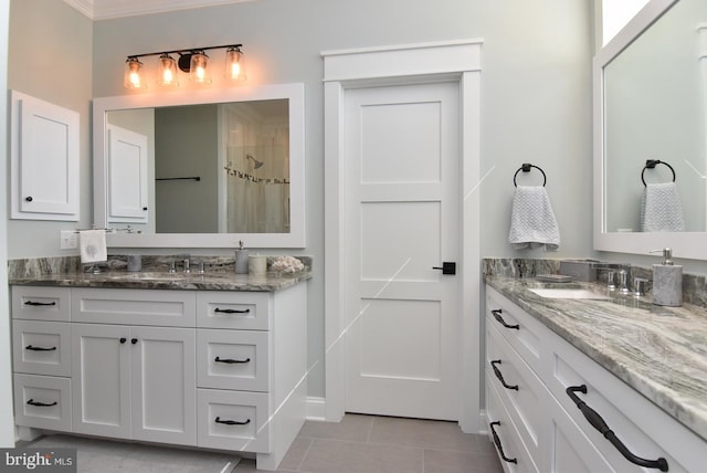 bathroom featuring tile patterned flooring, vanity, and ornamental molding