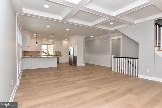 20682 Maple St, Rehoboth Beach, DE 19971 - unfurnished living room featuring coffered ceiling, light wood-style floors, recessed lighting, and beamed ceiling