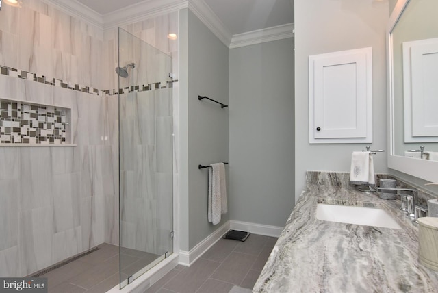 bathroom featuring crown molding, a shower with door, vanity, and tile patterned flooring